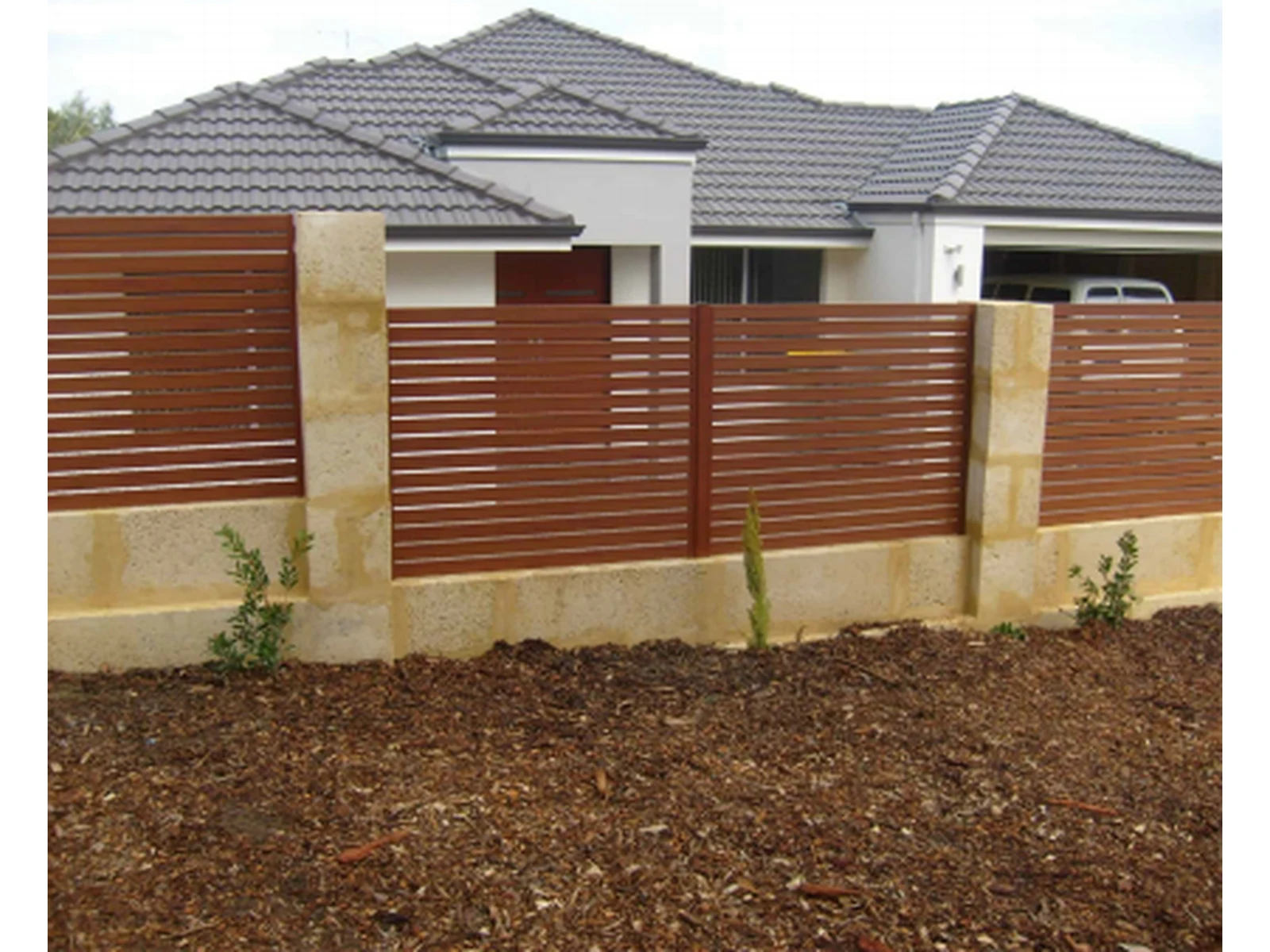 Modern Horizontal Slat Fence with Brown Red Panels and Stone Pillars-1 Modern Horizontal Slat Fence with Brown Red Panels and Stone Pillars