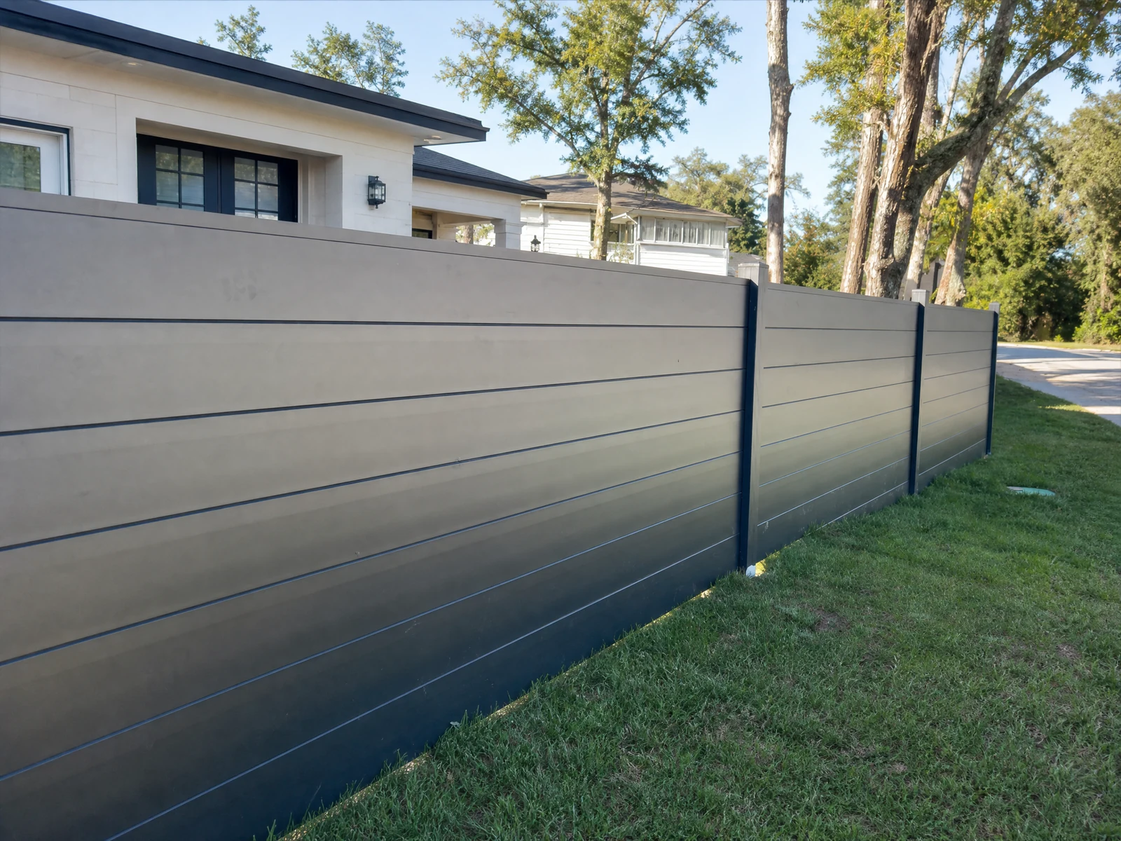 Modern Horizontal Slat Fence with Dark Gray Panels and Black Support Posts Modern Horizontal Slat Fence with Dark Gray Panels and Black Support Posts